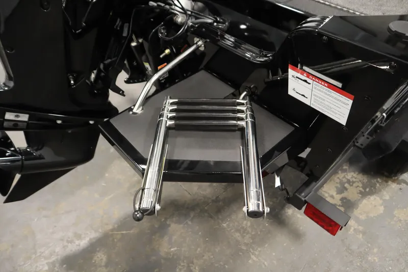 Slide: The Image of 2026 Lowe Fishing Machine 1625WT boat ladder and motor detail. - 38