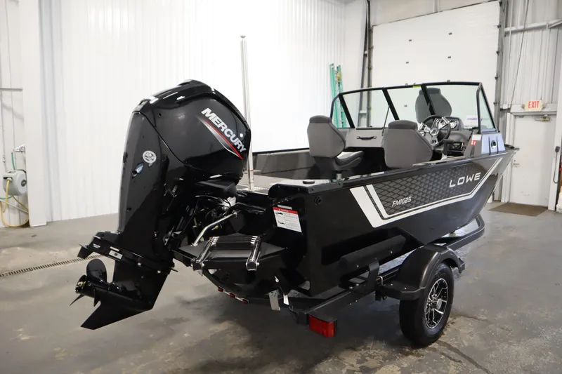 Slide: The Image of 2026 Lowe Fishing Machine 1625WT boat with Mercury engine in a garage setting. - 4