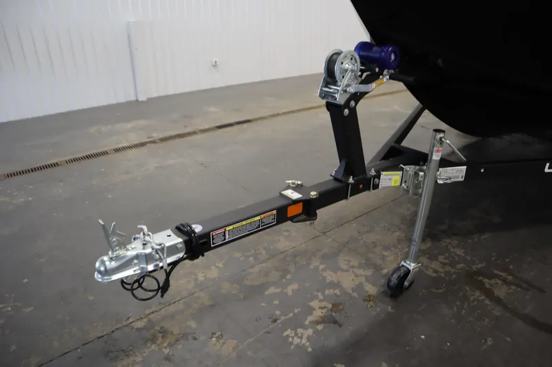 Slide: The Image of Trailer hitch of 2026 Lowe Fishing Machine 1625WT in a garage setting. - 43