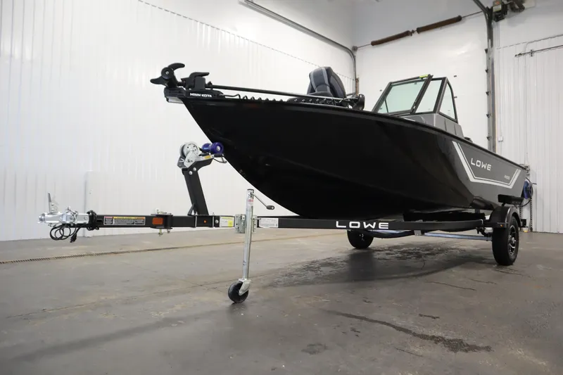 Slide: The Image of 2026 Lowe Fishing Machine 1625WT boat on trailer in a garage setting. - 44