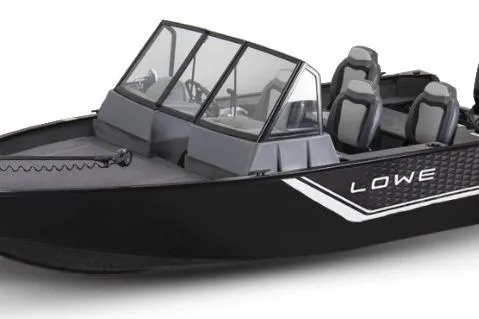 Slide: The Image of 2026 Lowe Fishing Machine 1625WT covered in a garage, ready for transport. - 46