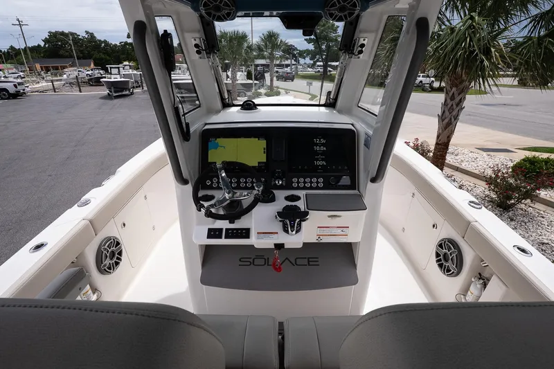 Slide: The Image of 2026 Solace 30 CS boat cockpit with advanced navigation system and sleek design. - 17