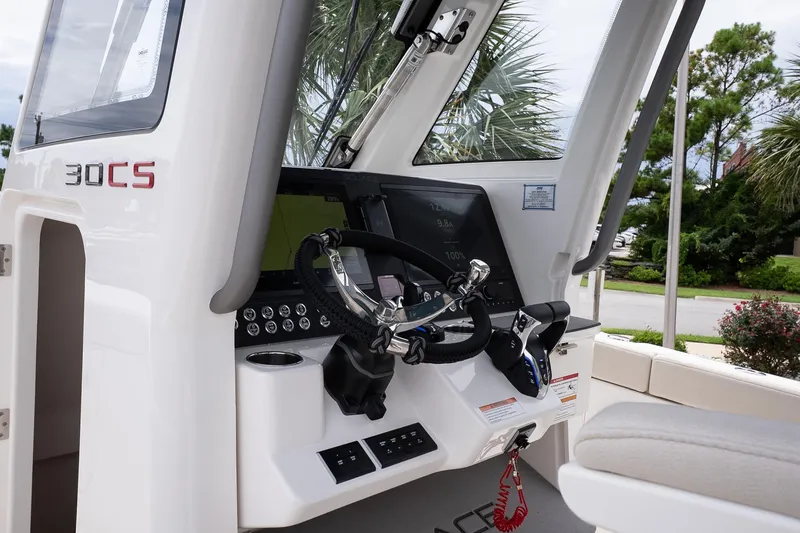 Slide: The Image of 2026 Solace 30 CS boat cockpit with modern steering and control panel. - 20