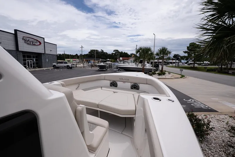 Slide: The Image of 2026 Solace 30 CS boat displayed at Performance East Inc dealership. - 25