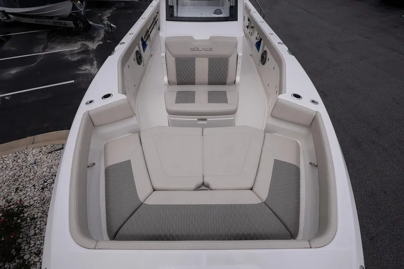 Slide: The Image of 2026 Solace 30 CS boat interior with cushioned seating and sleek design. - 28