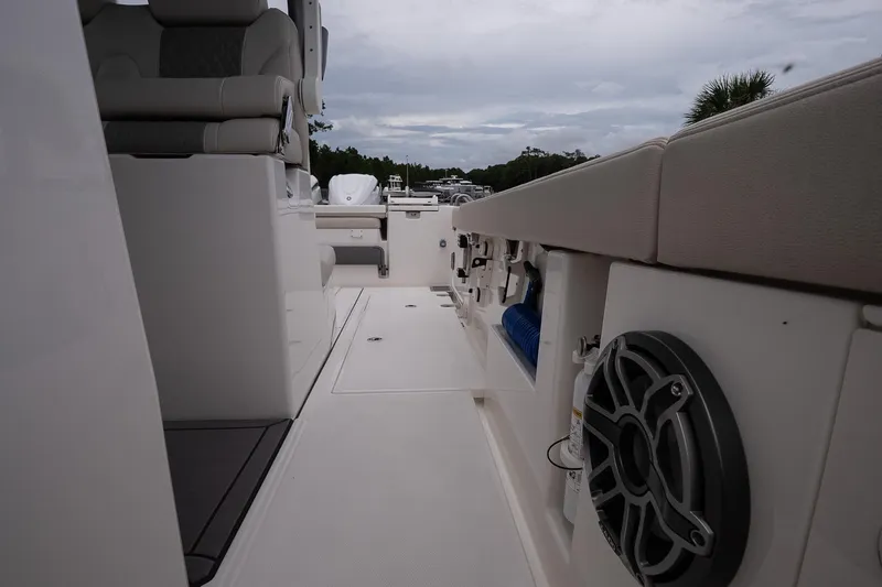 Slide: The Image of 2026 Solace 30 CS boat interior with seating and speaker, showcasing modern design. - 30