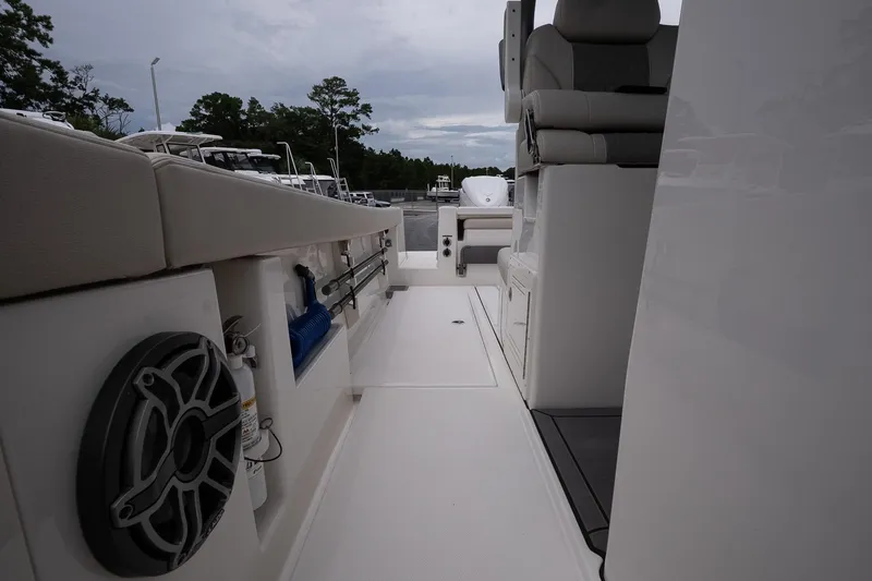 Slide: The Image of 2026 Solace 30 CS boat interior with seating and storage compartments. - 31