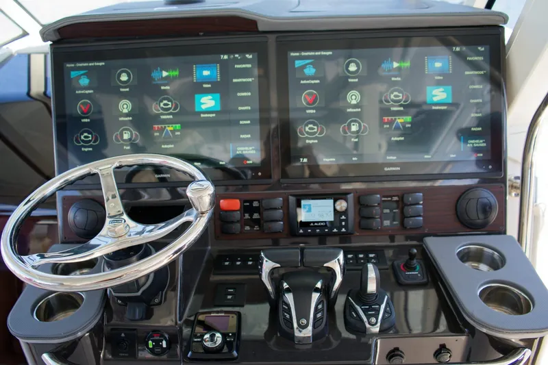 Slide: The Image of 2022 Pursuit S 428 Sport boat dashboard with dual touchscreen displays and controls. - 11