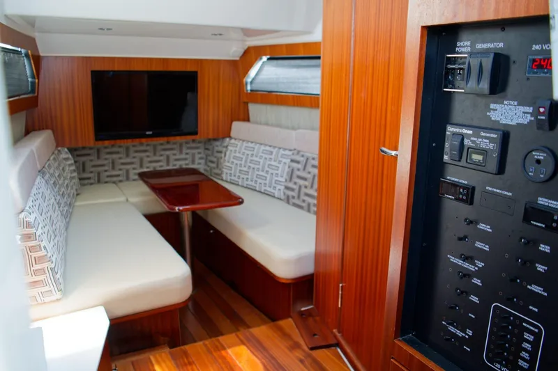 Slide: The Image of Luxurious interior of 2022 Pursuit S 428 Sport boat with seating and control panel. - 13
