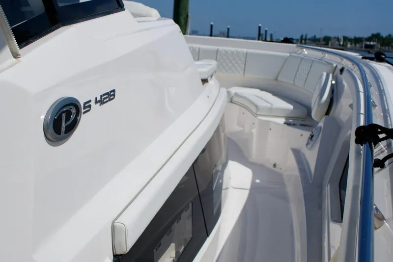 Slide: The Image of 2022 Pursuit S 428 Sport boat interior with sleek seating and modern design. - 18