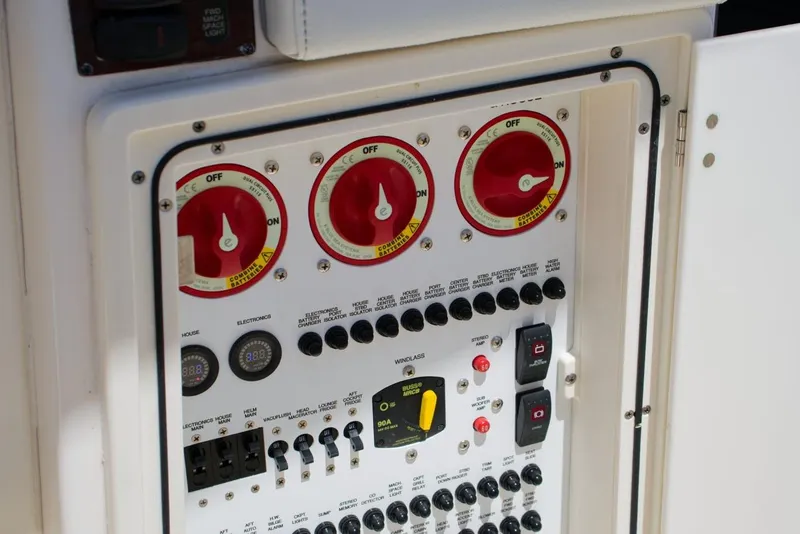 Slide: The Image of Electrical control panel on a 2022 Pursuit S 428 Sport boat. - 25