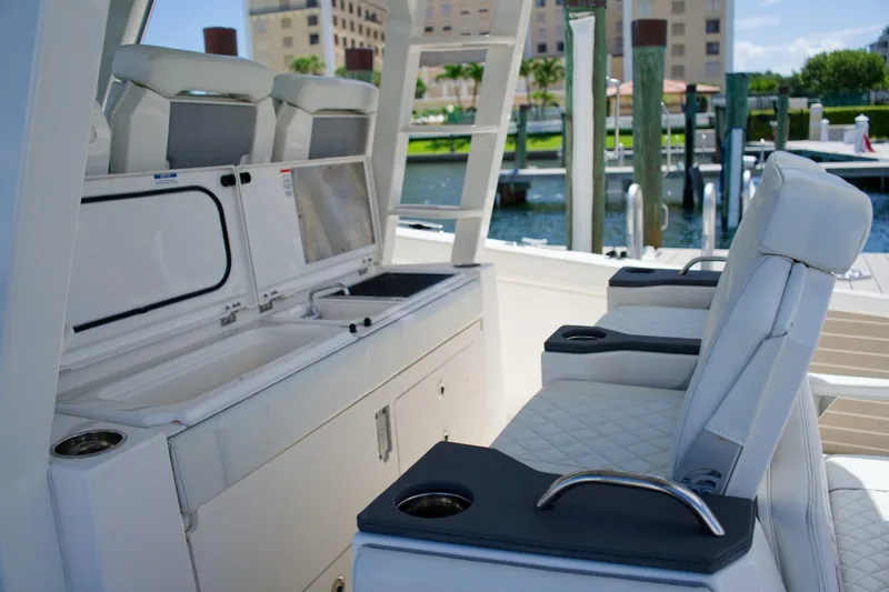 Slide: The Image of 2022 Pursuit S 428 Sport boat interior with luxurious seating and amenities. - 28