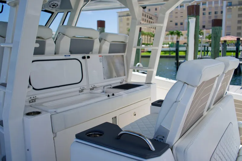 Slide: The Image of 2022 Pursuit S 428 Sport boat interior with luxurious seating and modern amenities. - 29