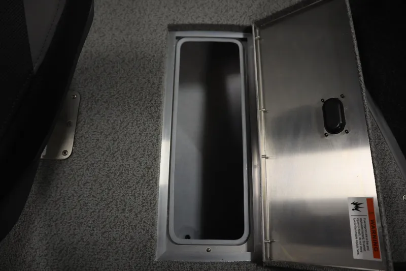 Slide: The Image of Open storage compartment in 2026 Lowe Fishing Machine 1675SC boat interior. - 19