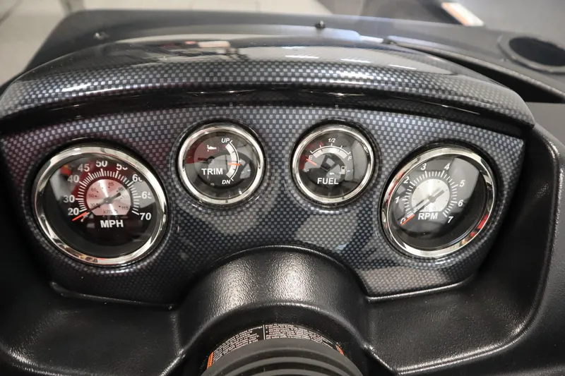 Slide: The Image of Dashboard of 2026 Lowe Fishing Machine 1675SC with speedometer, trim, fuel, and RPM gauges. - 23