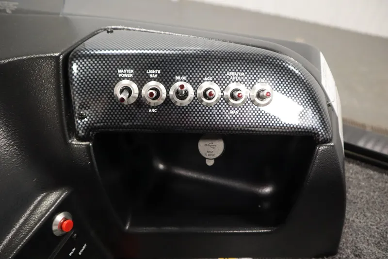Slide: The Image of Control panel of 2026 Lowe Fishing Machine 1675SC with switches and USB port. - 27