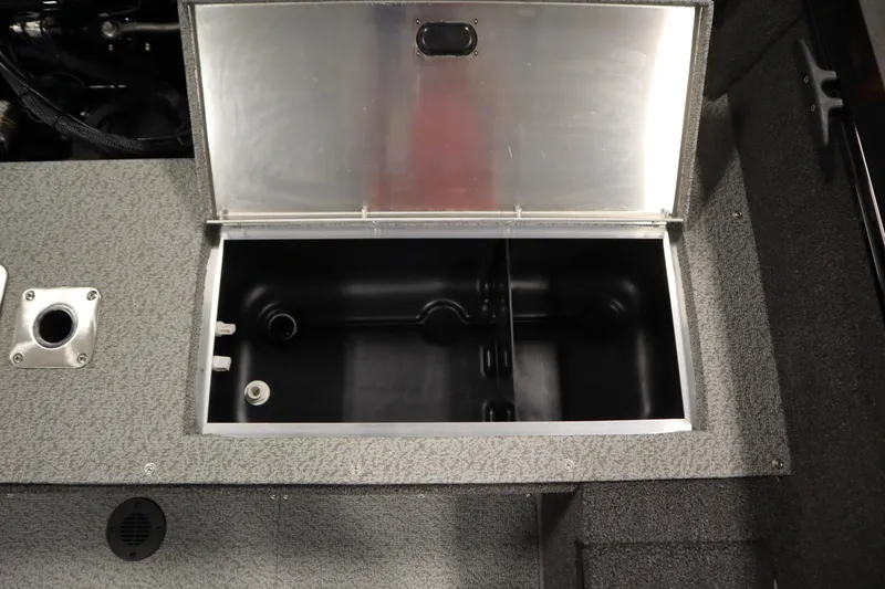 Slide: The Image of Open storage compartment in 2026 Lowe Fishing Machine 1675SC boat. - 34