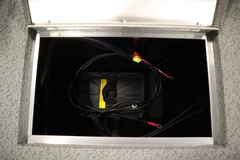Slide: The Image of Battery compartment of 2026 Lowe Fishing Machine 1675SC boat, featuring wiring and connections. - 36