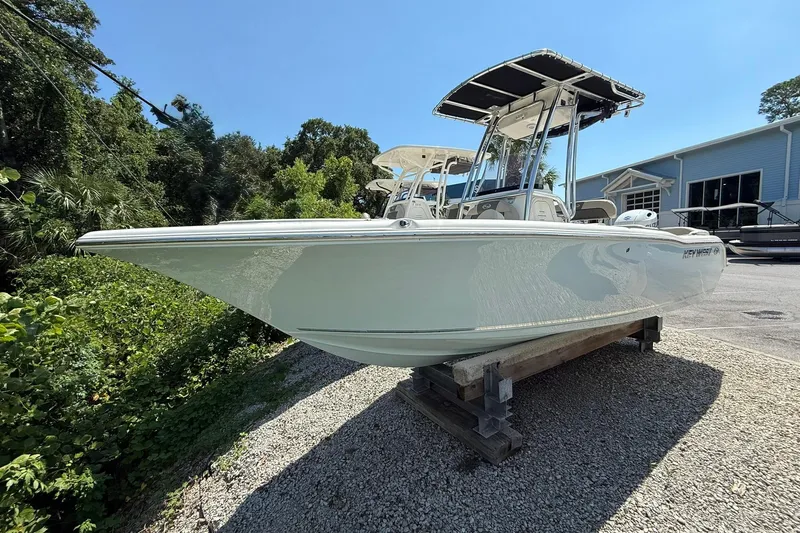 The Image of 2025 Key West 203 FS boat displayed outdoors on a gravel surface. - 0