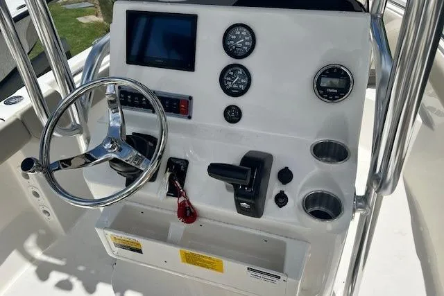 Slide: The Image of Steering console of 2025 Key West 203 FS boat with gauges and controls. - 4