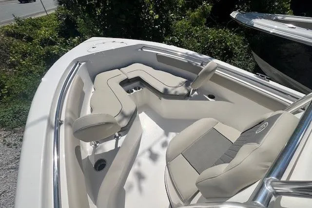 Slide: The Image of 2025 Key West 203 FS boat interior with cushioned seating and sleek design. - 7