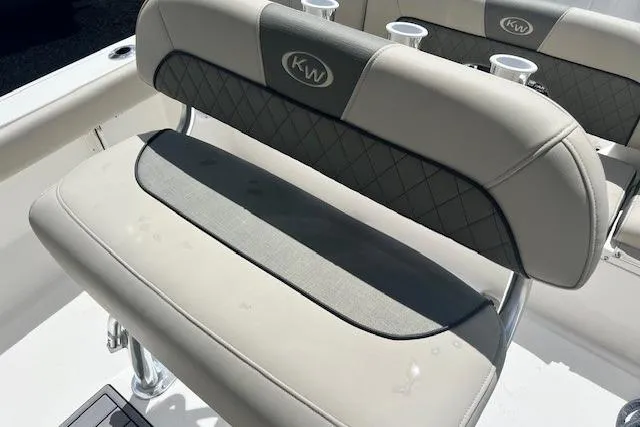 Slide: The Image of 2025 Key West 203 FS boat seat with cup holders and KW logo. - 9