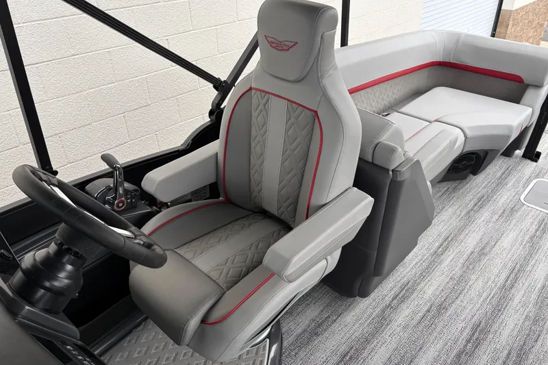 Slide: The Image of 2026 Bennington 24 MFB boat interior with luxurious seating and modern steering console. - 12