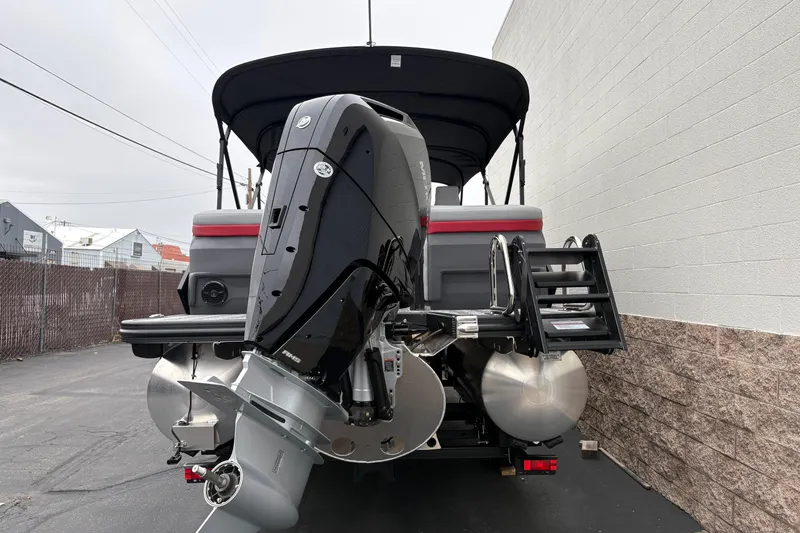 Slide: The Image of 2026 Bennington 24 MFB boat with powerful outboard motor and sleek design. - 4