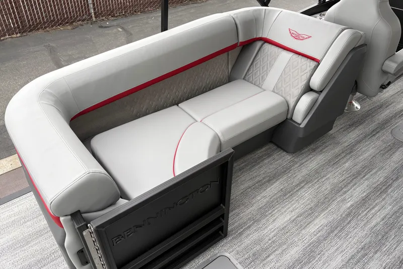 Slide: The Image of Luxurious seating on 2026 Bennington 24 MFB boat with elegant gray and red upholstery. - 7