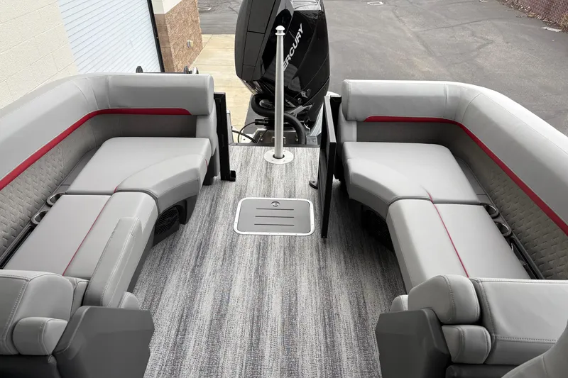 Slide: The Image of 2026 Bennington 24 MFB boat interior with gray seating and red accents. - 9