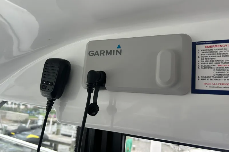 Slide: The Image of Garmin marine radio setup on 2024 Beneteau Antares 11 boat dashboard. - 13