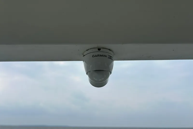 Slide: The Image of Garmin camera installed on 2024 Beneteau Antares 11 boat, under cloudy sky. - 33