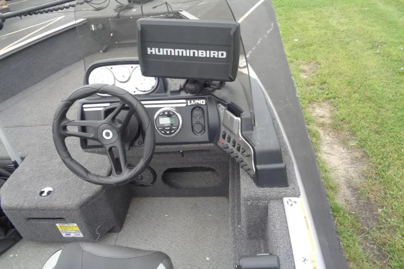 Slide: The Image of 2022 Lund 1775 Adventure SS boat dashboard with Humminbird fish finder and steering wheel. - 11