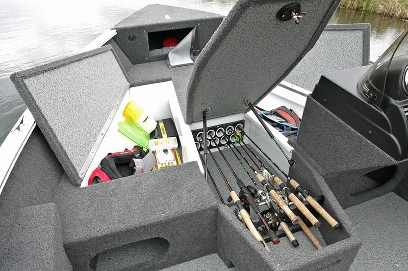 Slide: The Image of Manufacturer Provided Image: 2022 Lund 1775 Adventure SS fishing boat with open storage compartments and fishing rods. - 16