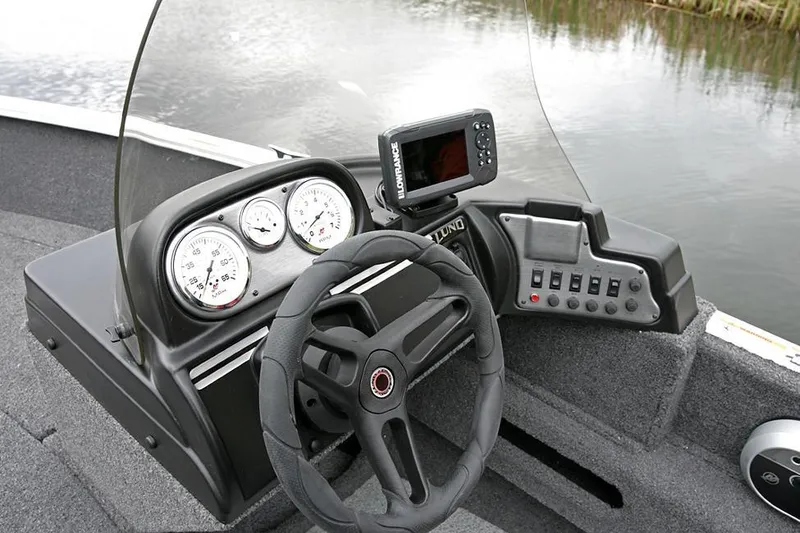 Slide: The Image of Manufacturer Provided Image: 2022 Lund 1775 Adventure SS boat dashboard with steering wheel and gauges. - 17