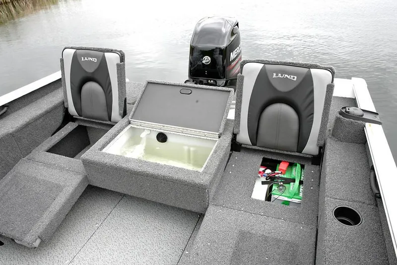 Slide: The Image of Manufacturer Provided Image: 2022 Lund 1775 Adventure SS boat interior with storage compartments and Mercury outboard motor. - 18