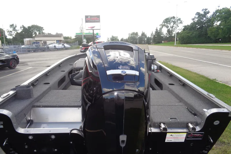 Slide: The Image of 2022 Lund 1775 Adventure SS boat with Mercury engine, parked on roadside. - 26