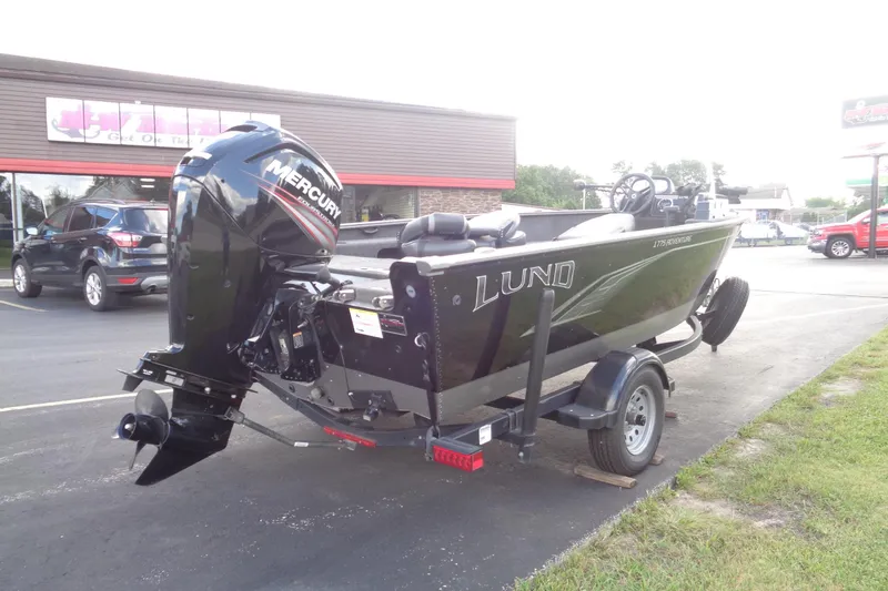 Slide: The Image of 2022 Lund 1775 Adventure SS boat with Mercury outboard motor on a trailer. - 27