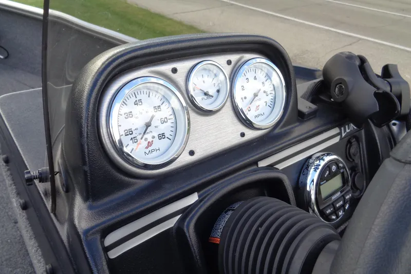 Slide: The Image of Dashboard of 2022 Lund 1775 Adventure SS boat with speedometer and controls. - 35