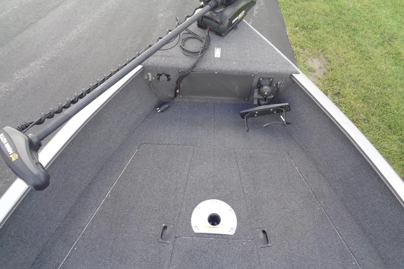 Slide: The Image of 2022 Lund 1775 Adventure SS boat interior with trolling motor and carpeted deck. - 38