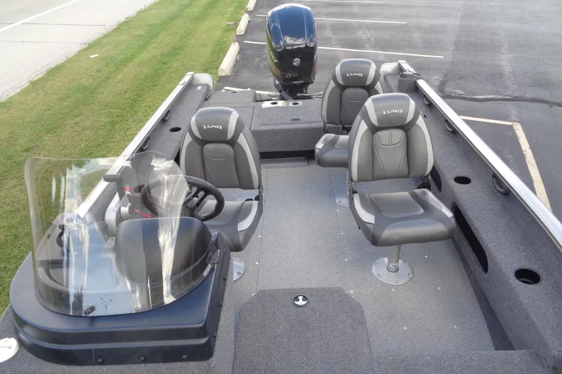 Slide: The Image of 2022 Lund 1775 Adventure SS boat interior with seating and steering console. - 39