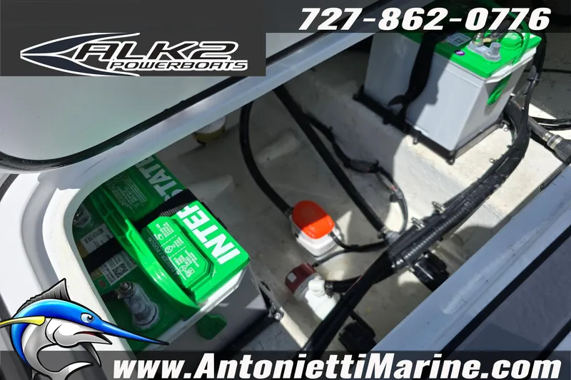 Slide: The Image of Battery compartment of 2025 ALK2 Powerboats 22BHX FLATS/BAY HYBRID, featuring marine batteries. - 16