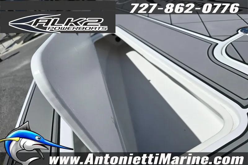 Slide: The Image of 2025 ALK2 Powerboats 22BHX FLATS/BAY HYBRID deck detail with contact information and logo. - 18