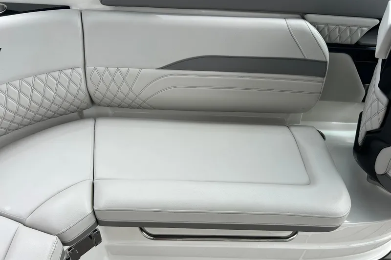 Slide: The Image of 2023 Sea Ray SLX 260 boat interior with luxurious white leather seating. - 10
