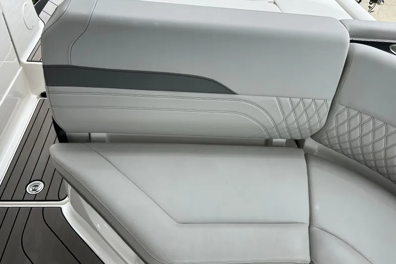 Slide: The Image of 2023 Sea Ray SLX 260 boat seat with elegant gray upholstery and quilted design. - 12