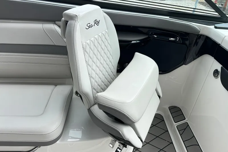 Slide: The Image of 2023 Sea Ray SLX 260 interior with luxurious white seating and elegant design. - 15