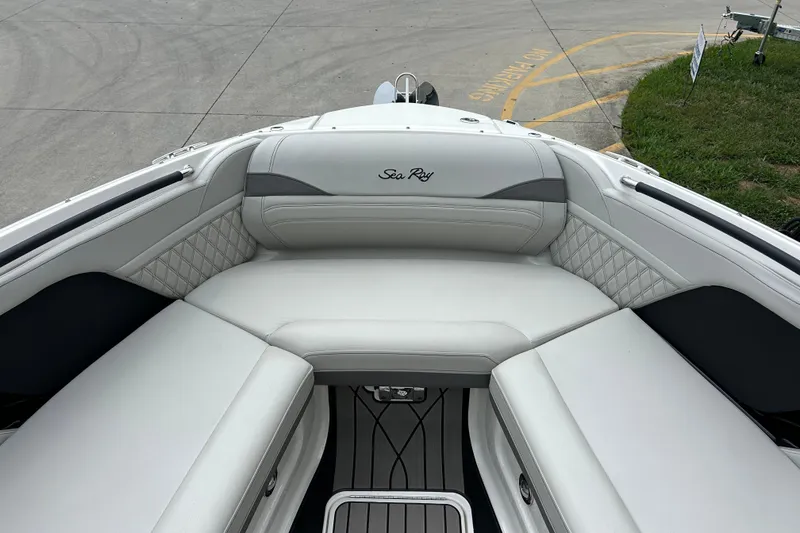Slide: The Image of 2023 Sea Ray SLX 260 boat interior with luxurious white seating and elegant design. - 18