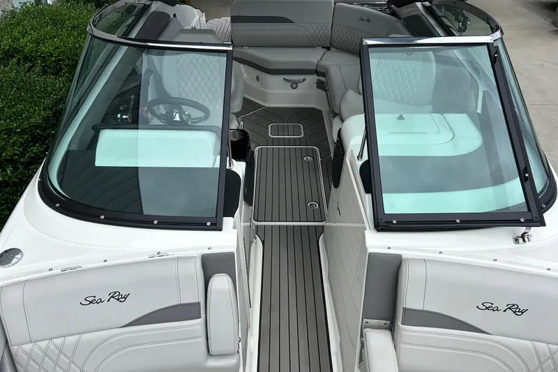 Slide: The Image of 2023 Sea Ray SLX 260 boat interior with sleek seating and modern design. - 20