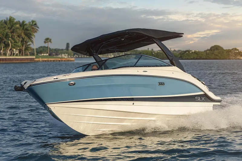 Slide: The Image of Manufacturer Provided Image: 2023 Sea Ray SLX 260 boat cruising on water. - 28