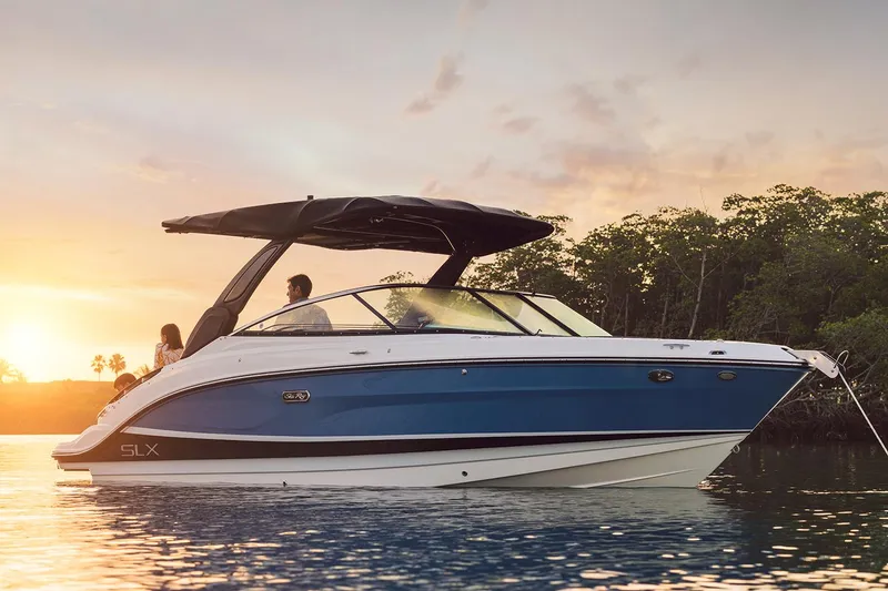 Slide: The Image of Manufacturer Provided Image: 2023 Sea Ray SLX 260 boat cruising at sunset. - 30